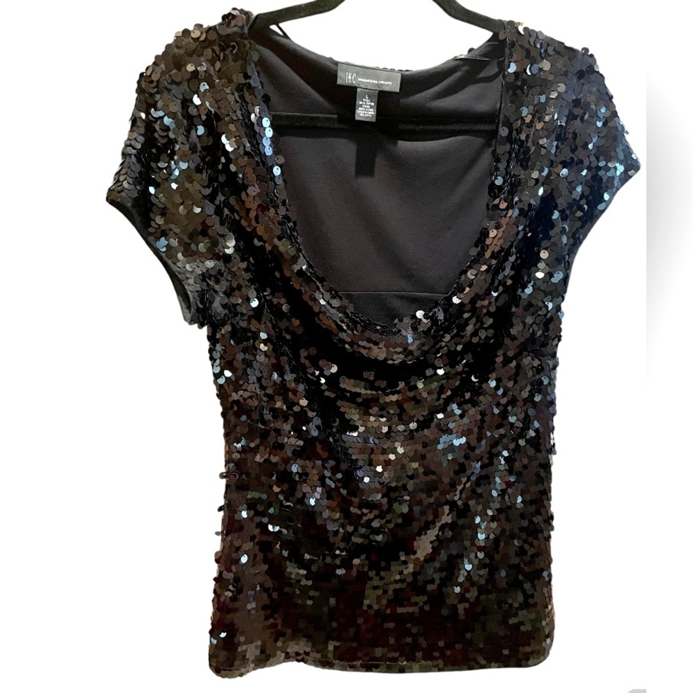 Sequined top with draped collar.